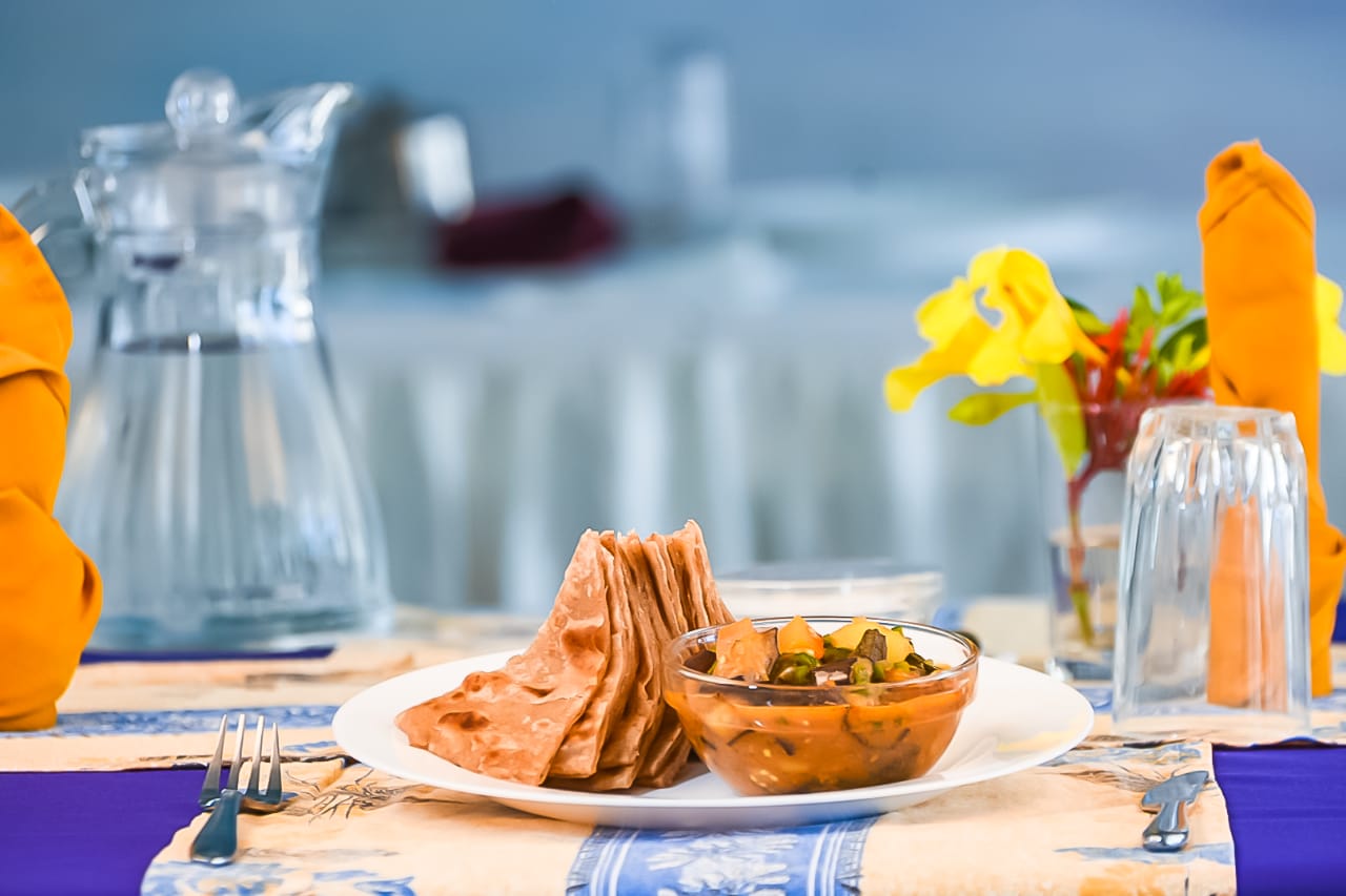 Chapati and vegetable stew with a sea view