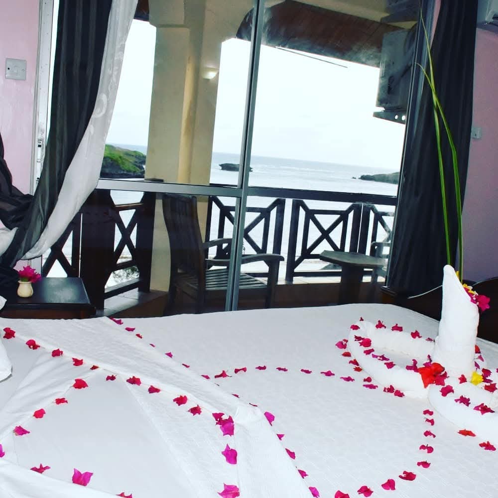 Guest room decorated with flower petals, ocean view
